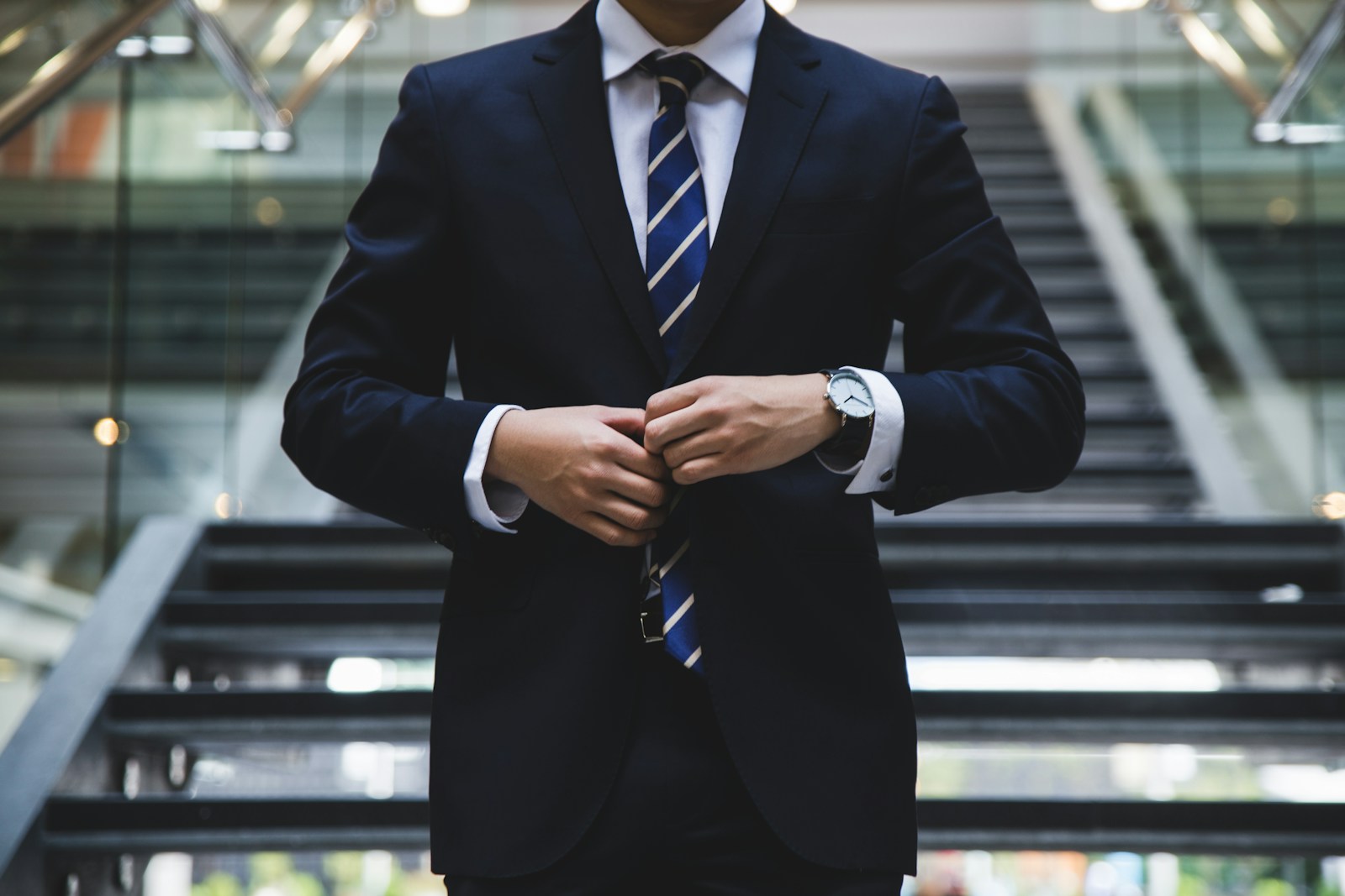 Negotiation table with counsel and clients reviewing commercial dispute settlement terms